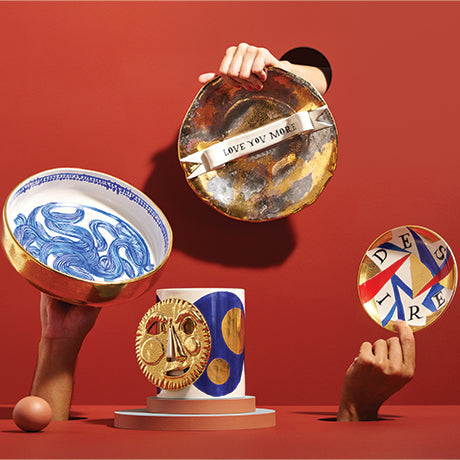 Decorative plates and a mask on a red background
